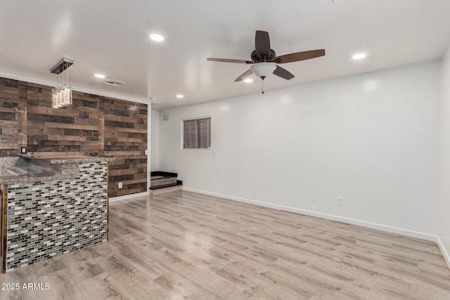 interior space with a ceiling fan, baseboards, visible vents, recessed lighting, and light wood-type flooring