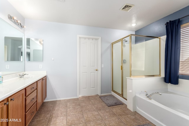 bathroom featuring tile patterned flooring, vanity, and shower with separate bathtub