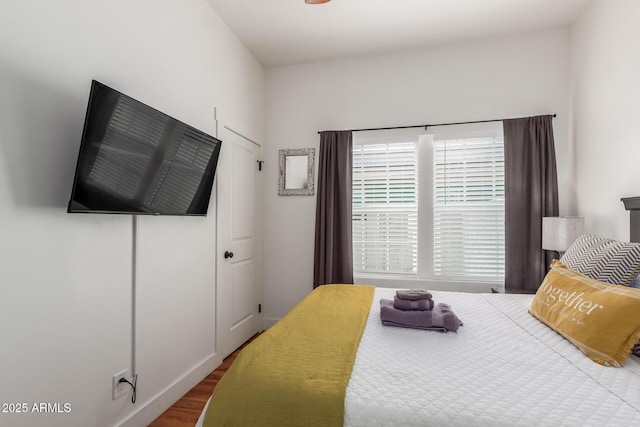 bedroom with wood finished floors