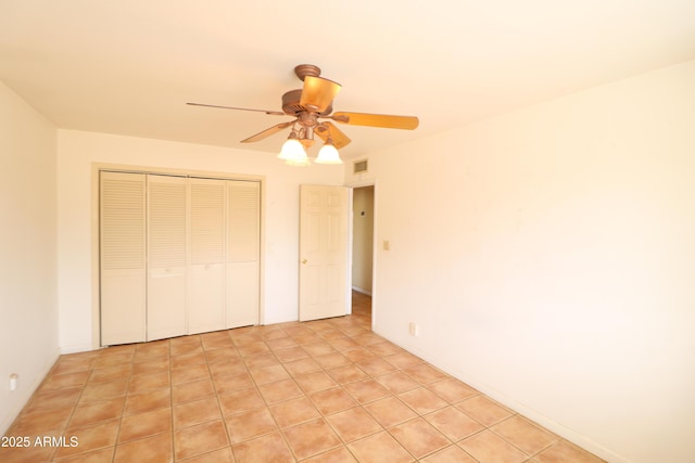 36655 N 25th St, Cave Creek, AZ 85331 - unfurnished bedroom with a closet, visible vents, a ceiling fan, and light tile patterned floors