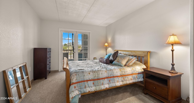 carpeted bedroom featuring a textured ceiling