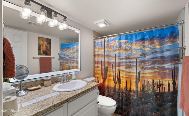 bathroom with a shower with curtain, vanity, and toilet