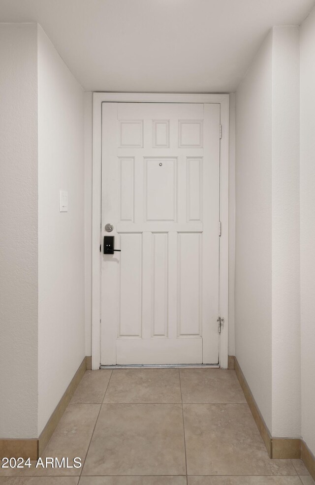 doorway to outside featuring light tile patterned floors