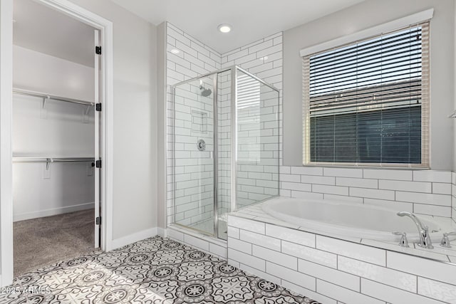 bathroom with tile patterned floors and separate shower and tub