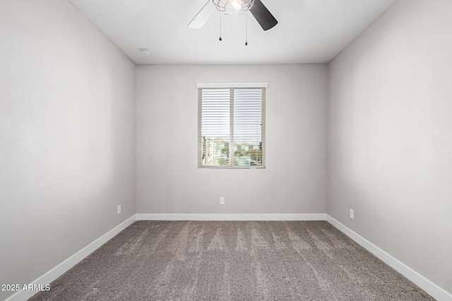 spare room featuring carpet floors and ceiling fan