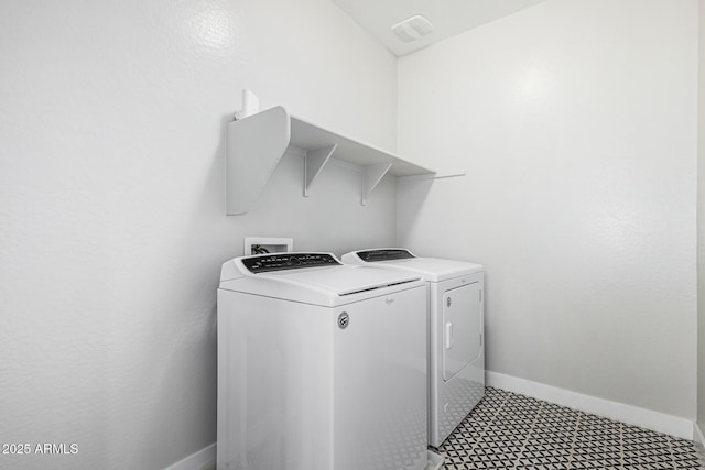 laundry room featuring washing machine and dryer