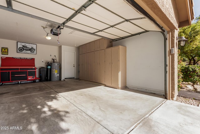 garage featuring a garage door opener and water heater