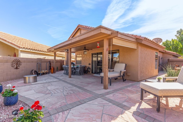 view of patio featuring ceiling fan