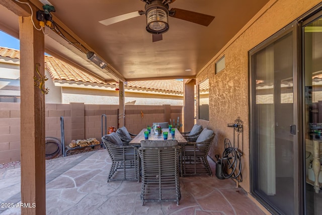 view of patio featuring ceiling fan