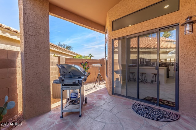 view of patio / terrace with a bar and grilling area