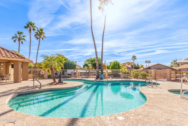 view of swimming pool with a patio