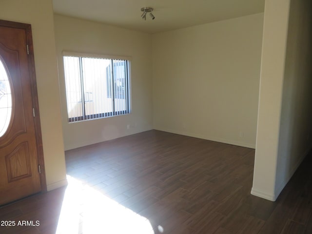 foyer entrance with dark hardwood / wood-style flooring