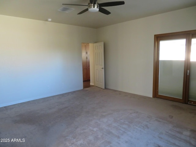 unfurnished room featuring carpet floors and ceiling fan