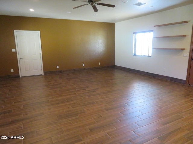 unfurnished room featuring ceiling fan and dark hardwood / wood-style flooring