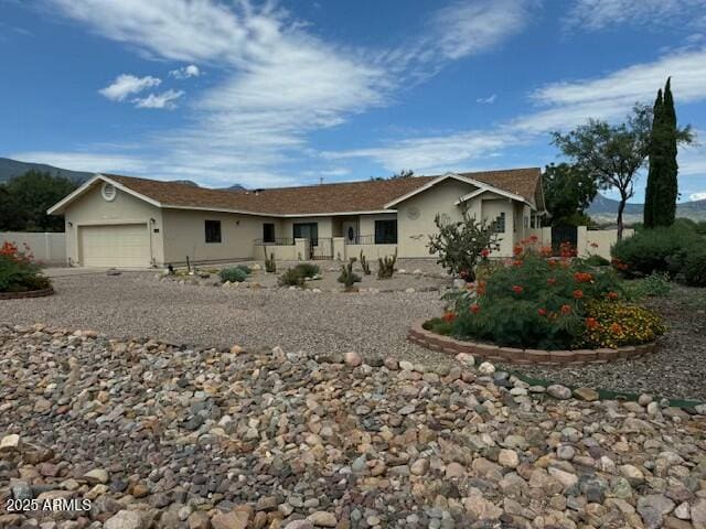 ranch-style home with a garage