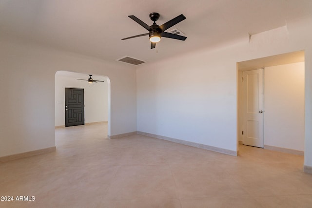 unfurnished room with ceiling fan