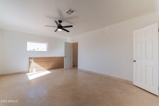 unfurnished room with ceiling fan