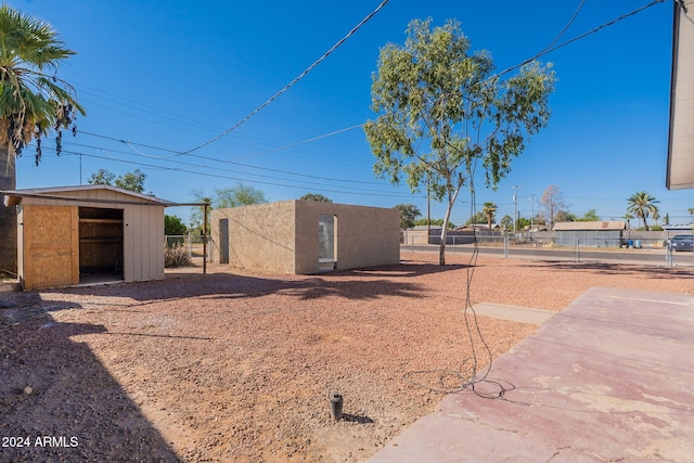 exterior space featuring a storage unit