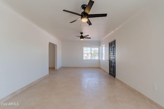 unfurnished room with ceiling fan