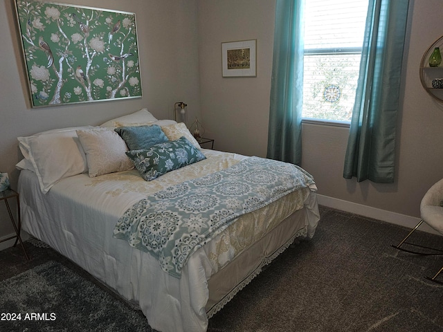 bedroom with dark carpet