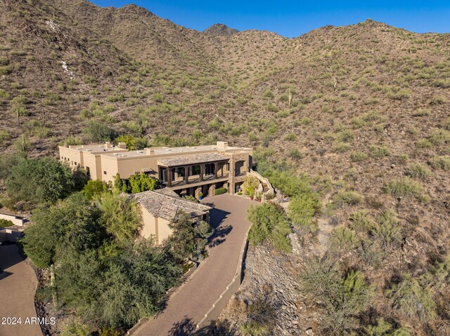 exterior space with a mountain view and a garage