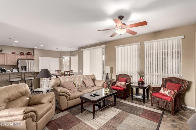 living room featuring a ceiling fan and recessed lighting