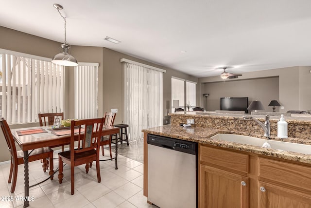 kitchen featuring a sink, visible vents, open floor plan, stainless steel dishwasher, and pendant lighting