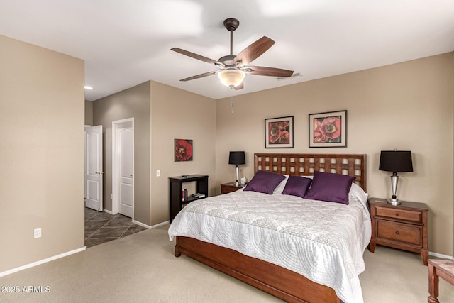 carpeted bedroom featuring visible vents, baseboards, and a ceiling fan