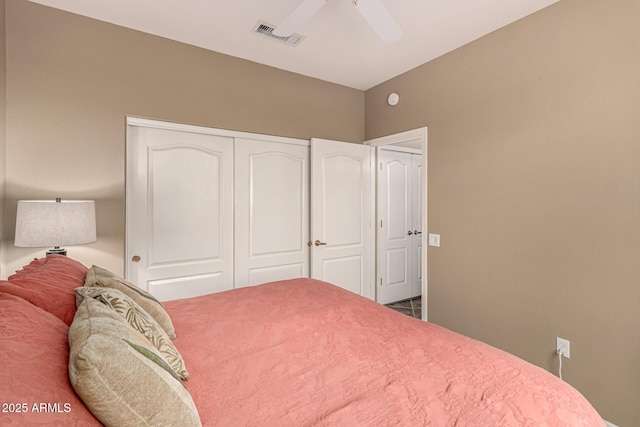 bedroom featuring a closet, visible vents, and ceiling fan