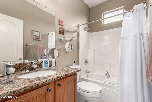 bathroom with toilet, a textured wall, shower / bathtub combination with curtain, and vanity