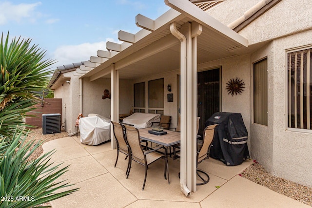 view of patio featuring grilling area, cooling unit, and outdoor dining space