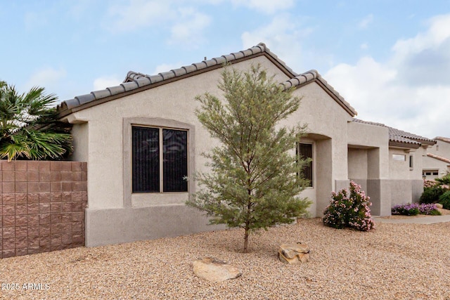 view of home's exterior with stucco siding