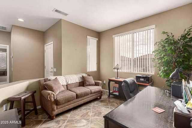 office space featuring visible vents and baseboards