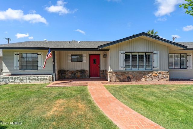 710 E Hayward Ave, Phoenix, AZ 85020 - single story home with a front yard, board and batten siding, and a shingled roof