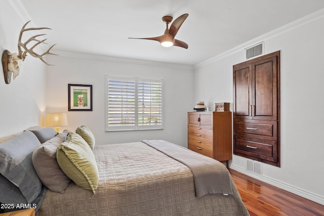 710 E Hayward Ave, Phoenix, AZ 85020 - bedroom with wood finished floors, ornamental molding, a ceiling fan, and baseboards