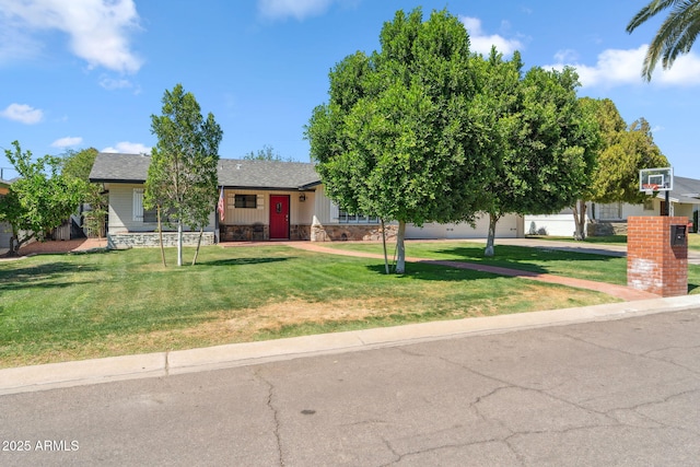 710 E Hayward Ave, Phoenix, AZ 85020 - view of front of property with a front lawn, board and batten siding, roof with shingles, and stone siding