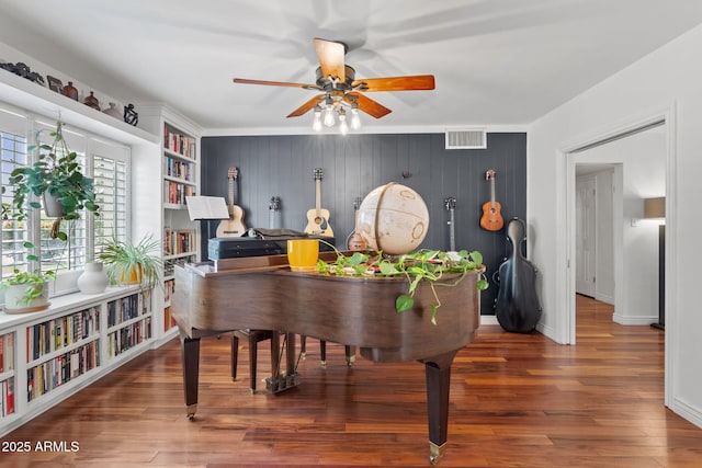 710 E Hayward Ave, Phoenix, AZ 85020 - living area featuring ceiling fan, wood finished floors, and baseboards