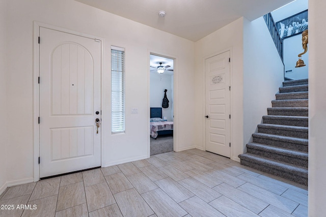 22960 N 94th Ln, Peoria, AZ 85383 - entrance foyer with stairway, ceiling fan, and healthy amount of natural light