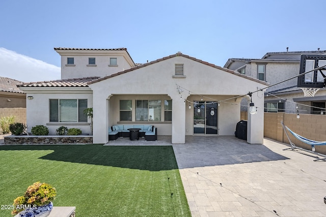 22960 N 94th Ln, Peoria, AZ 85383 - rear view of property featuring stucco siding, an outdoor living space, a patio area, and a tile roof