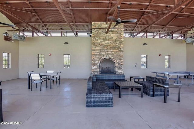 22960 N 94th Ln, Peoria, AZ 85383 - view of patio featuring an outdoor living space with a fireplace and outdoor dining area