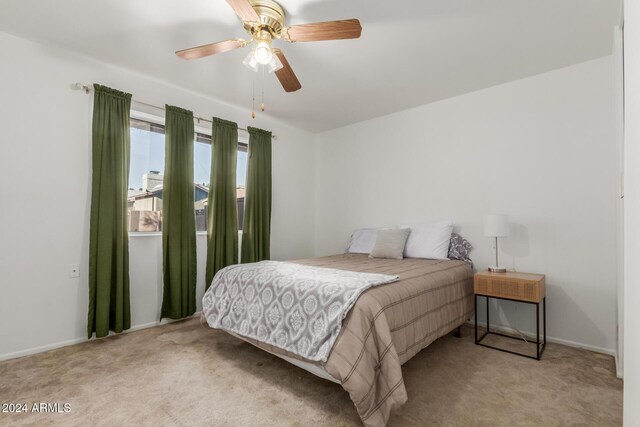 carpeted bedroom featuring ceiling fan