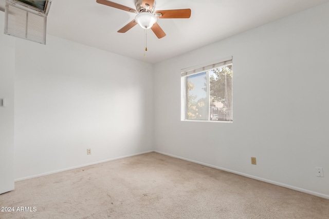 unfurnished room featuring ceiling fan and light colored carpet