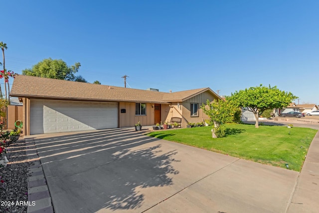 ranch-style home featuring a front yard and a garage