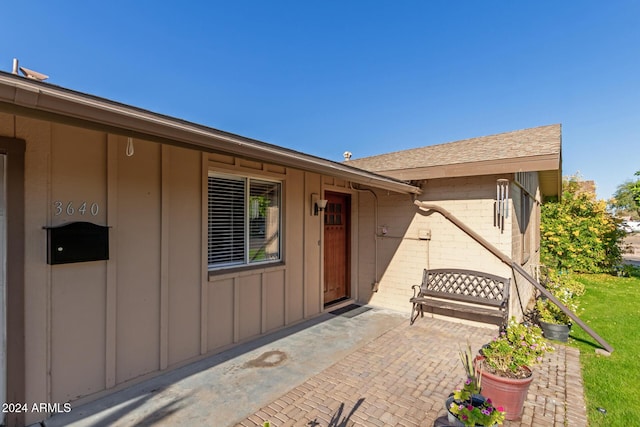 property entrance with a patio area