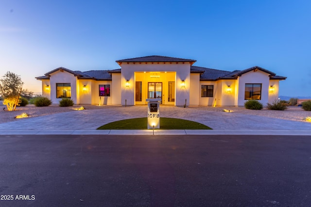 10918 W Dove Roost Rd, Queen Creek, AZ 85144 - mediterranean / spanish house with curved driveway, stucco siding, and a tiled roof
