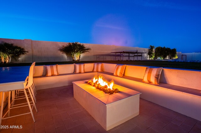 10918 W Dove Roost Rd, Queen Creek, AZ 85144 - view of patio / terrace featuring an outdoor fire pit