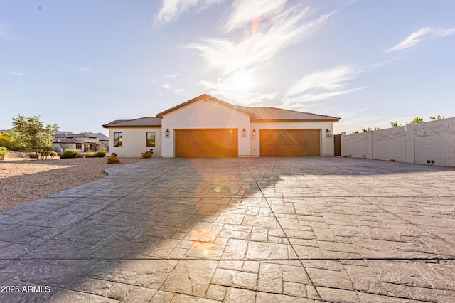 10918 W Dove Roost Rd, Queen Creek, AZ 85144 - view of front of property featuring decorative driveway, stucco siding, and an attached garage
