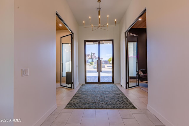 10918 W Dove Roost Rd, Queen Creek, AZ 85144 - foyer entrance featuring a chandelier, french doors, light tile patterned floors, and baseboards