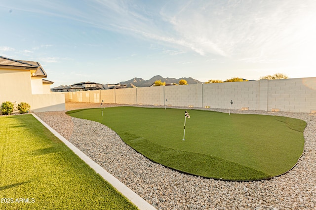 10918 W Dove Roost Rd, Queen Creek, AZ 85144 - fenced backyard featuring a putting green