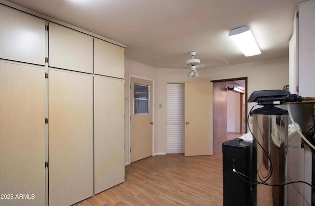 kitchen featuring ceiling fan and light wood-type flooring